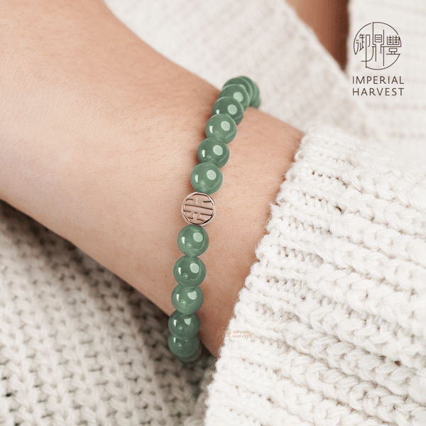 Model wearing Imperial Harvest Jadeite Bracelet with Charm