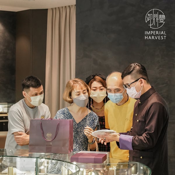 Master David presenting clients with Imperial Harvest signature Pu-Erh Tea Brick