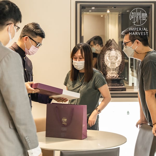 Master David presenting clients with Imperial Harvest signature Pu-Erh Tea Brick